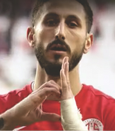 Sagiv Yehezkel gestures with his hand a half heart following the scoring of his famous goal. Photo: YouTube generated.