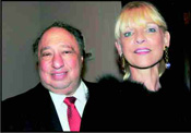 John Castimatidis, CEO of Red Apple Group, with his wife, Margo.