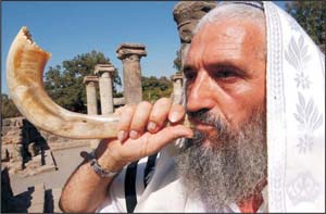 Shofar blowing at an ancient synagogue in Israel.