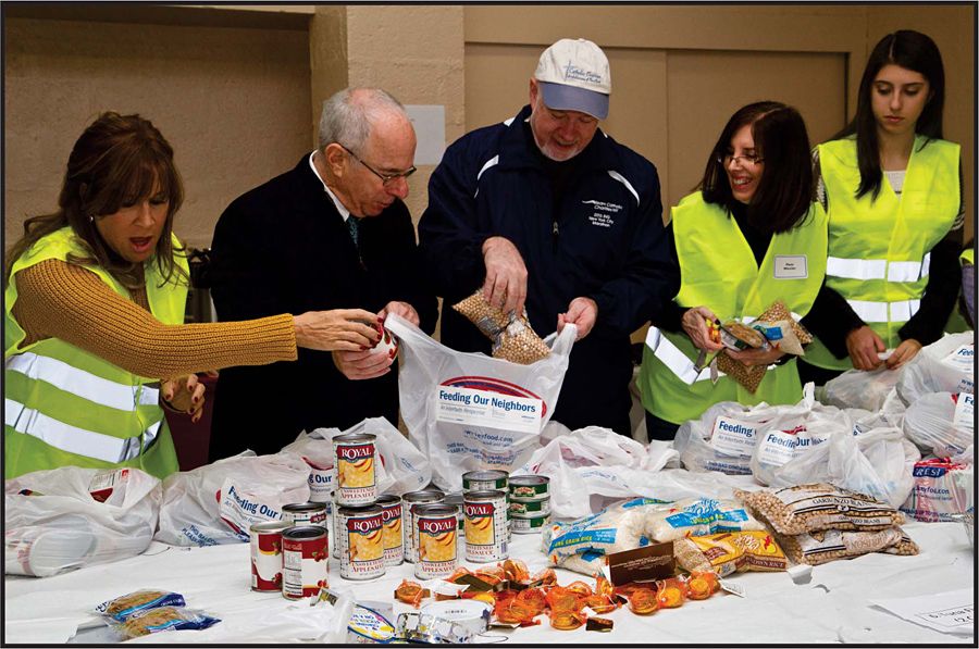 Jewish and Catholic communities launched initiative with Thanksgiving and Hanukkah food packaging project, an interfaith response initiative to feed NY's hungry.