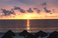 Sunrise at Paradisus: The rising sun shines on the water in front of the secluded beach at Paradisus Riviera Cancun Resort on September 24.
