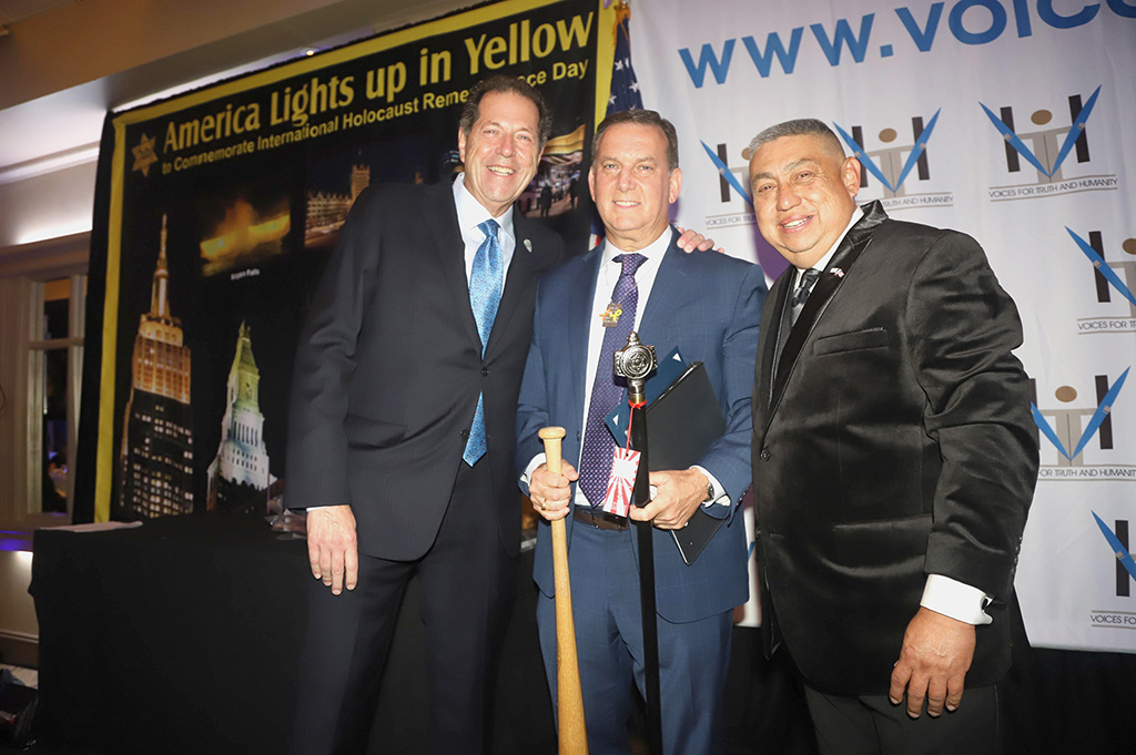 Jack Britvan, President of Voices, honoree Rick Lewis and Angel Cepeda, Treasurer of Voices.