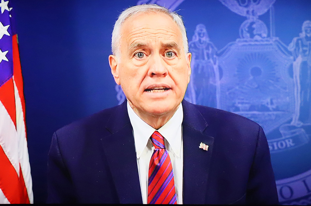 NY State Comptroller, Tom DiNapoli, address the audience via video.