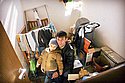 Timor Mishalov with his son Eldad in their home which was hit by a Quassam rocket in the southern town of Sderot. Photo: Eliyahu Ben Yigal/Jinipix/Israel Sun