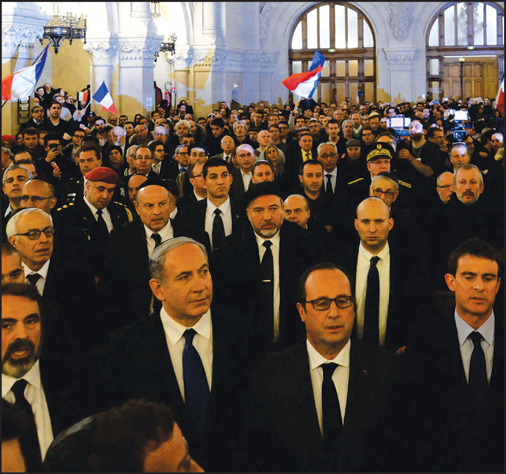 Israeli Prime Minister, Benjamin Netanyahu (foreground center-left) and French President Hollande, (foreground center-right) at the Synagogue memorial. Photo: Haim Zach GPO for Israel Sun