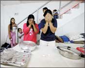 Shabath eve in Ashqelon, in the shelter of an apartment building, mothers and children prepare to greet the Shabath - praying over the Shabbat evening meal. Photo: Eddie Israel/Israel Sun