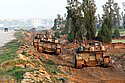 Israel tanks on the Gaza border near the Sufa checkpoint. In the background is the Gazan town of Rafah. Photo: Eliyahu Ben Yigal/Jinipix/Israel Sun