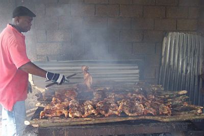 King Kong checking on the jerk chicken at Scotchies